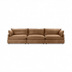 Modern Caplan stationary sectional sofa by Classic Home with plush cushions and sleek design in a contemporary living room setting.