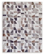 Signature Design by Ashley Jettner area rug with geometric pattern in neutral tones, showcasing soft woven fabric and decorative edges.