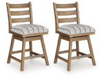 Pair of Benchcraft® Ridgester upholstered swivel barstools in light brown with cushioned seats and backrests, set of two.