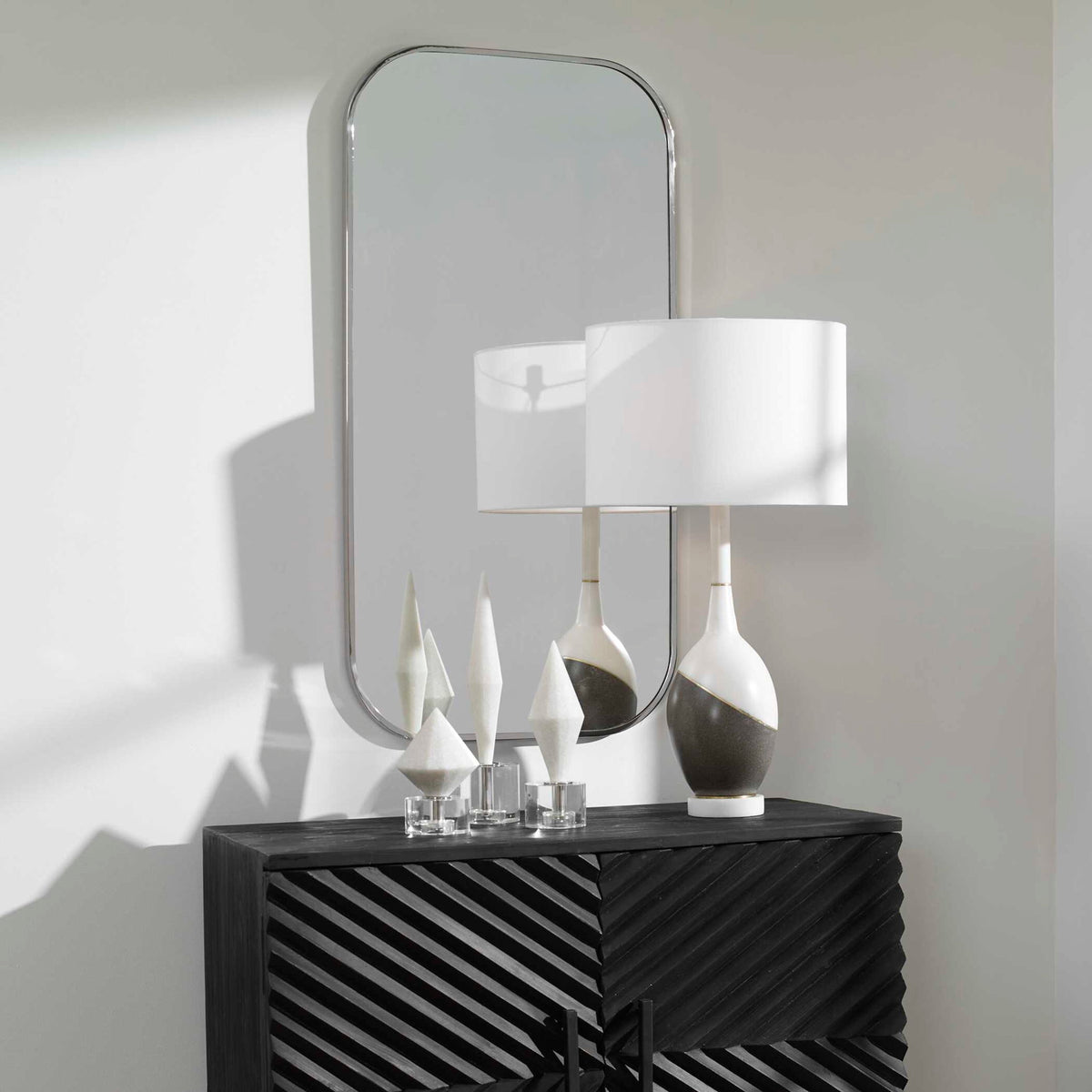 Uttermost Taft wall mirror with a sleek, modern frame, showcasing a stylish and reflective surface for contemporary home decor.