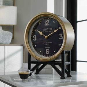 Black Shyam tabletop clock by Uttermost, featuring a sleek, modern design for stylish home or office decor.