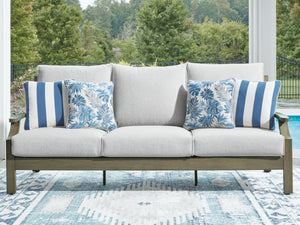 Brown and beige Rainier Ranch sofa with cushions by Signature Design by Ashley, featuring a comfortable, stylish living room setup.