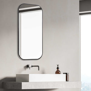 Uttermost Taft wall mirror with a sleek, modern frame, reflecting a contemporary interior design style.