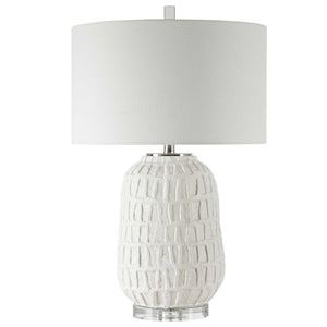 White textured table lamp by Uttermost with a modern design, featuring a sleek base and soft fabric shade for stylish illumination.