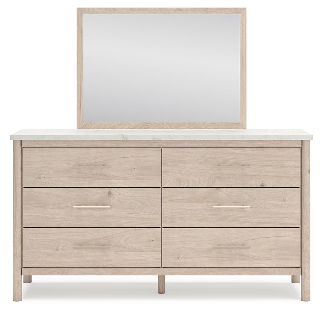 Signature Design by Ashley Cadmori six drawer dresser with a dark wood finish and modern hardware, showing the front view.