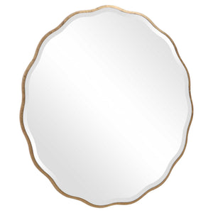 Uttermost Aneta round wall mirror with a sleek frame, hanging on a wall, showcasing its modern design and reflective surface.