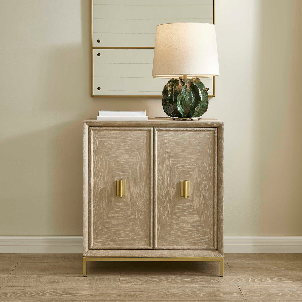 Uttermost Alessia 2-door accent cabinet in light brown wood with sleek, modern design and smooth door handles.