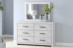 Whitewashed dresser and mirror set by Signature Design by Ashley, featuring a modern, sleek design with ample storage.