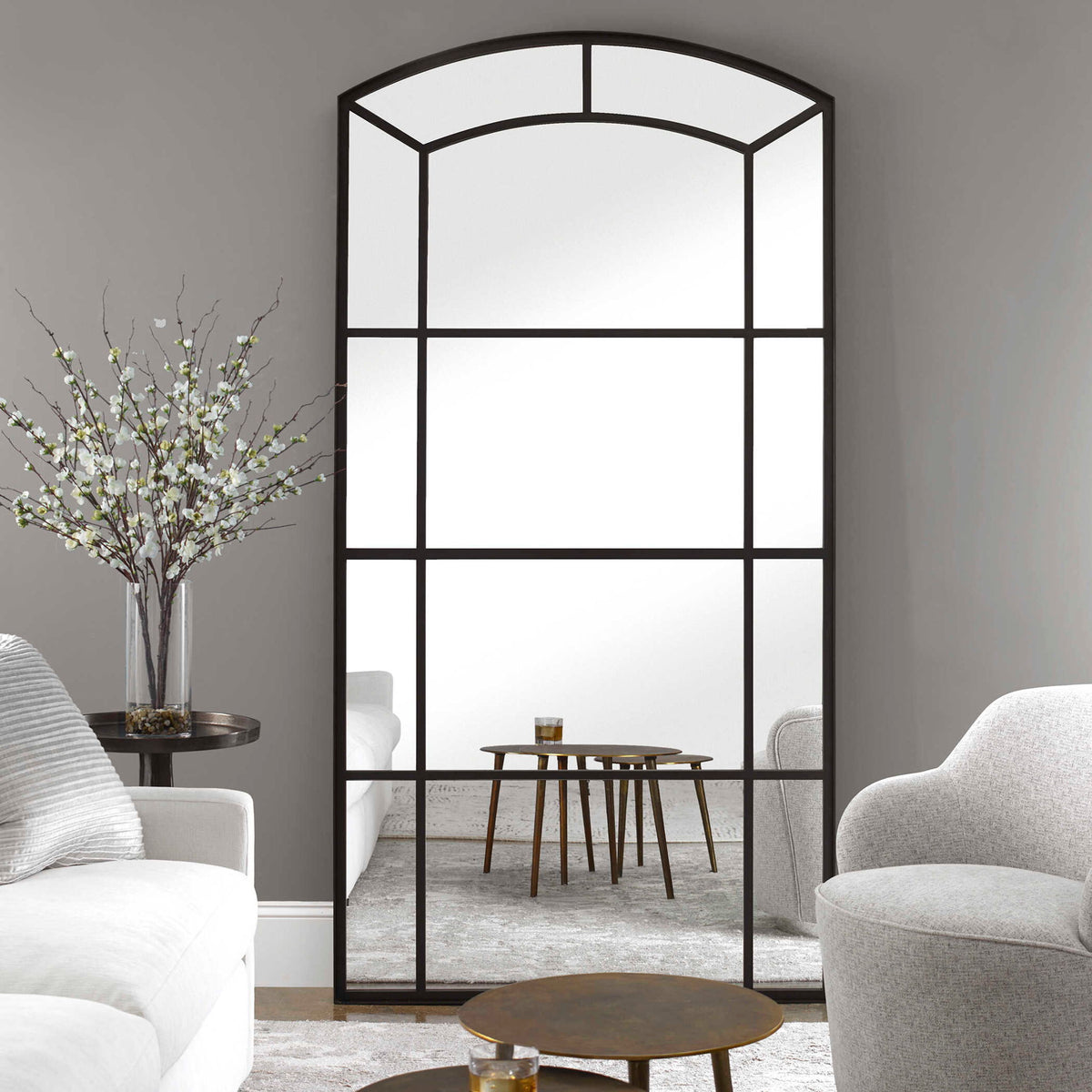 Black oversized arch mirror from Uttermost's Camber accent mirror collection, featuring a sleek, modern design with a bold black frame.