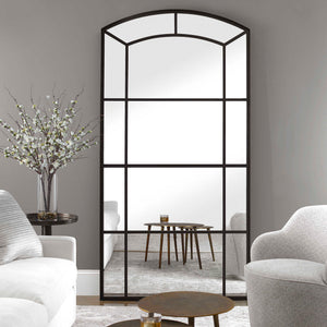 Black oversized arch mirror from Uttermost's Camber accent mirror collection, featuring a sleek, modern design with a bold black frame.
