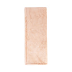 Classic Home Taiga throw blanket with textured fabric in neutral tones, perfect for cozying up on the sofa.