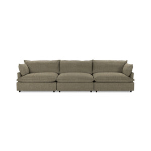 Classic Home Caplan modular sectional with plush cushions and contemporary design, shown in a spacious living room setting.