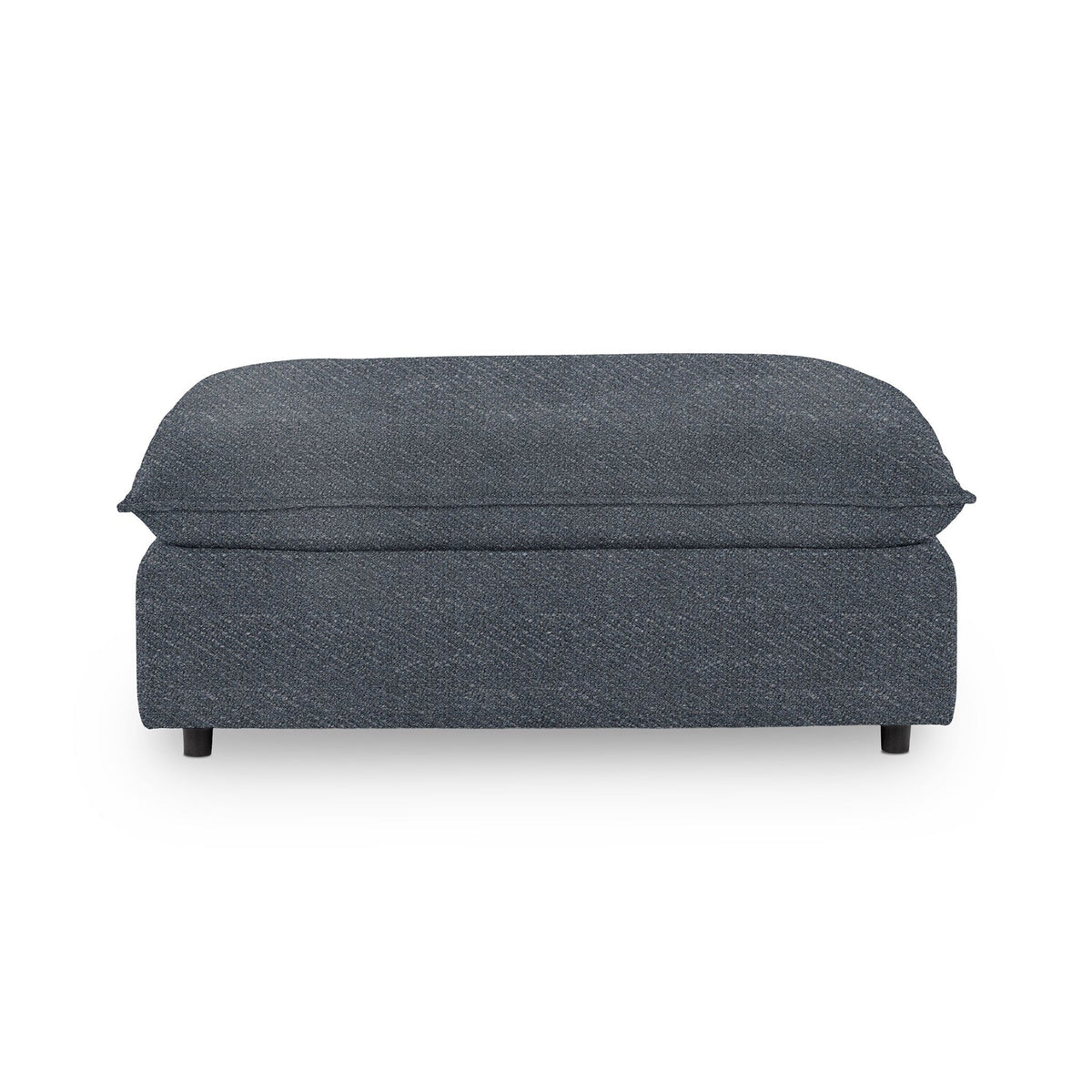 Classic Home Caplan upholstered ottoman with a cushioned top and wooden legs, ideal for living room or bedroom decor.