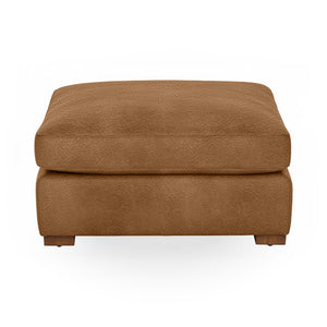 Classic Home Audrey upholstered ottoman with a plush fabric top and wooden legs, ideal as a stylish footrest or accent piece.