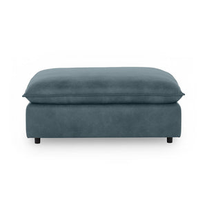 Classic Home Caplan upholstered ottoman with plush fabric and sturdy wooden legs, versatile for living room or seating area.