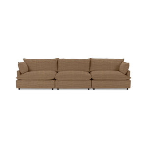 Classic Home Caplan modular sectional sofa with plush cushions and fabric upholstery, shown in a modern living room setting.