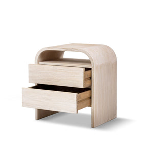 White washed Dune side table by Jennifer Taylor Home, featuring a sleek wooden design with a round top and sturdy legs.