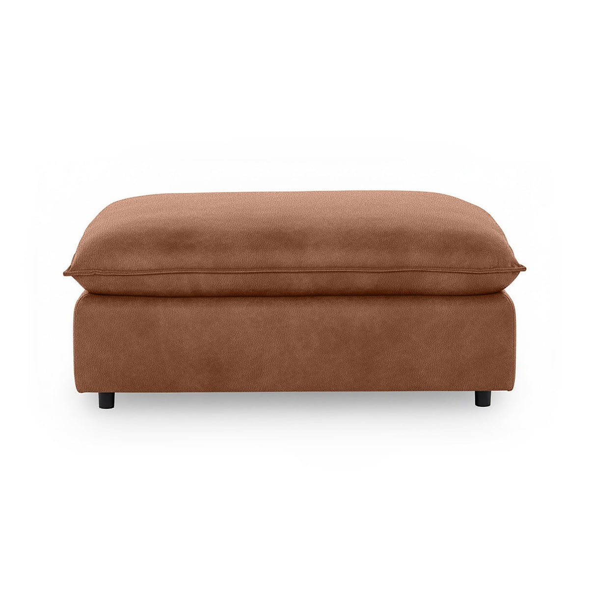 Classic Home Caplan upholstered ottoman with a plush fabric finish, serving as a versatile footrest or accent piece.