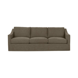 Classic Home Kipton upholstered stationary sofa with plush fabric, featuring wide armrests and comfy cushions in a stylish living room setting.