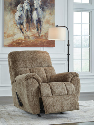 Signature Design by Ashley Stayfish rocker recliner with plush cushioning and wooden base, perfect for relaxing and lounging.