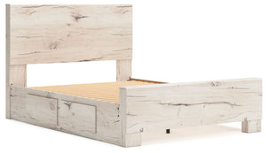 Signature Design by Ashley Lawroy storage bed with panel headboard and built-in storage drawers in a modern bedroom setting.