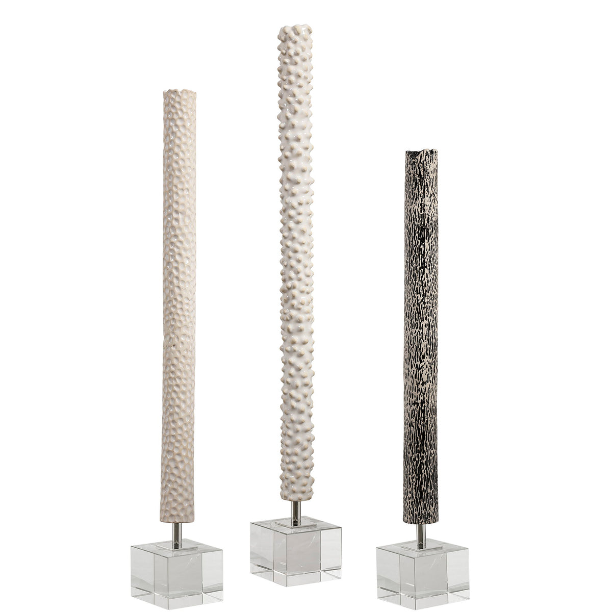 Set of three pearl silver cylindrical sculptures by Uttermost, modern decorative figurines for contemporary home decor.
