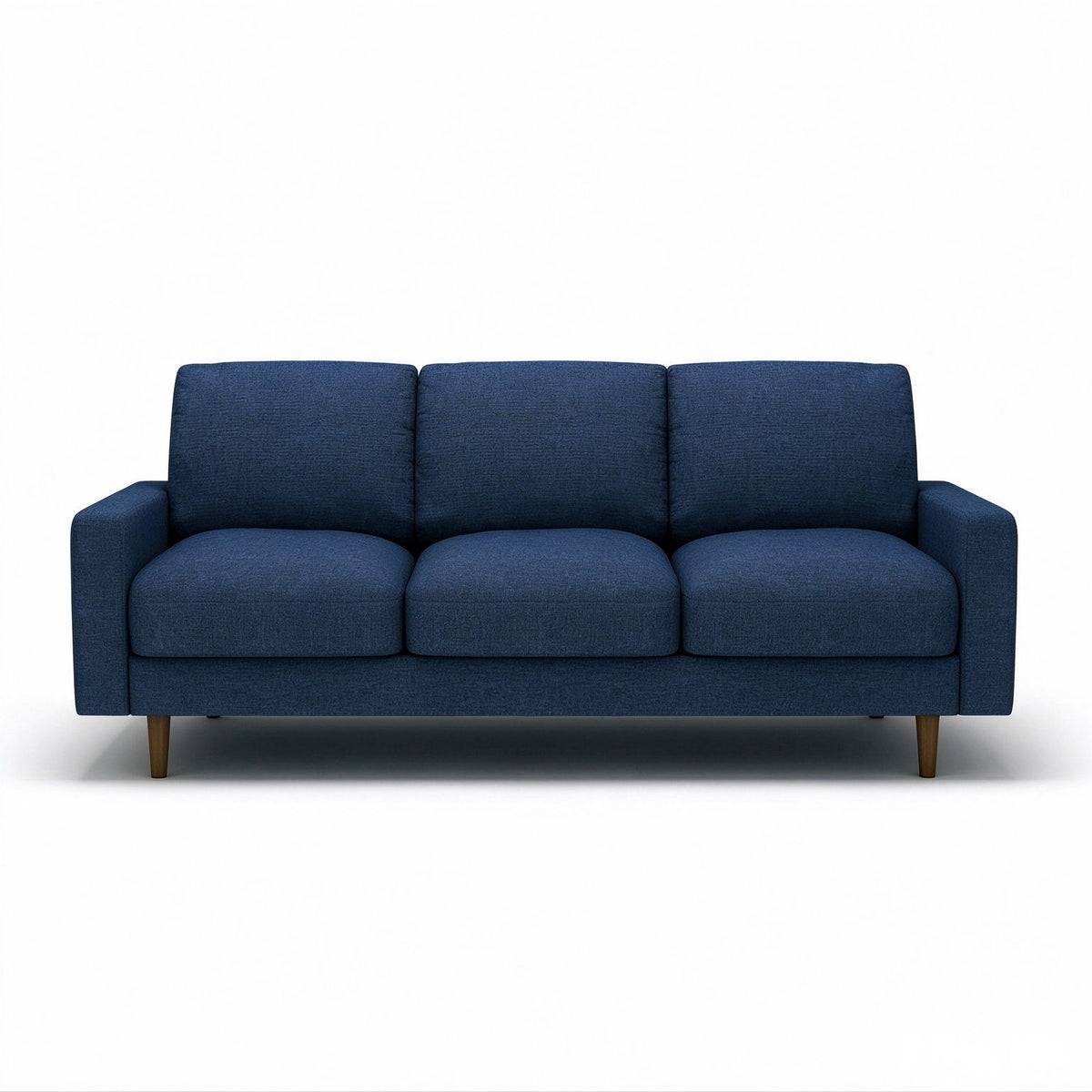 Dark blue US Pride 3 seater sofa with loose back cushions and accent pillows, perfect for a stylish living room.