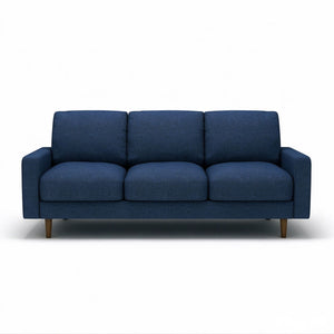 Dark blue US Pride 3 seater sofa with loose back cushions and accent pillows, perfect for a stylish living room.