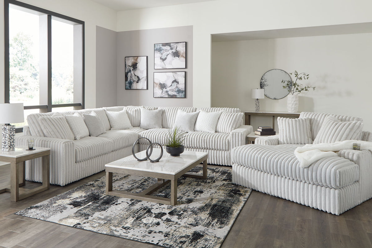 Signature Design by Ashley 5-piece living room set featuring a sofa, loveseat, and armchairs in a modern living space.