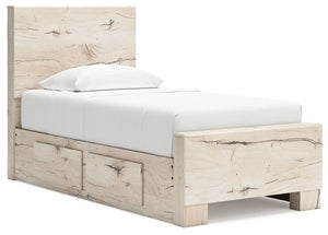 Signature Design by Ashley Lawroy panel bed with built-in storage drawers in a modern bedroom setting.