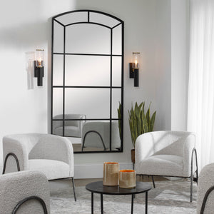 Black oversized arch accent mirror by Uttermost, featuring a sleek, modern design with a bold black frame.