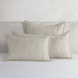 Classic Home Talia comforter set with coordinating pillow shams and decorative bedding in soft, neutral tones.