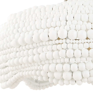White Biddeford 5-light beaded pendant lighting fixture by Uttermost hanging with beaded detailing and metal accents.