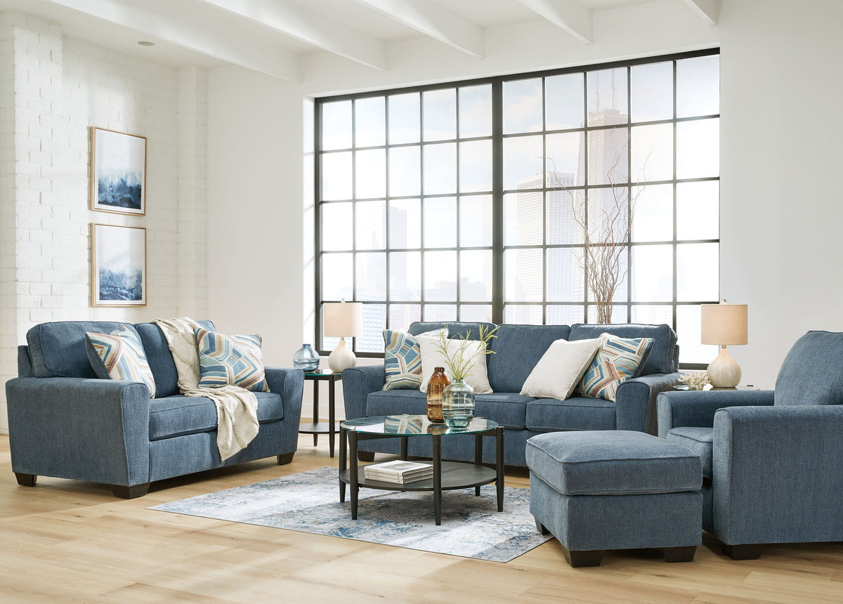 Signature Design by Ashley Cashton living room set with stationary chair and ottoman, featuring plush upholstery and modern style.