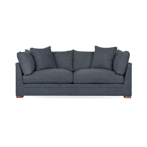 Classic Home Audrey stationary sofa with plush cushions and elegant design, showcasing a cozy living room setup.