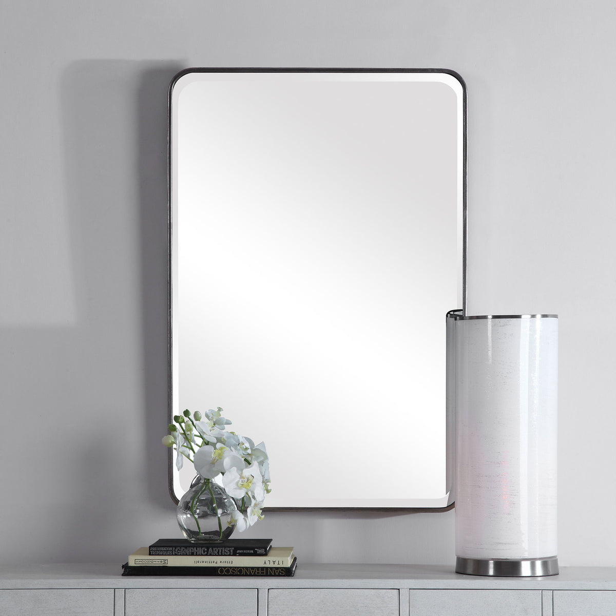 Uttermost silver wall mirror with a sleek, modern frame, perfect for contemporary home decor.
