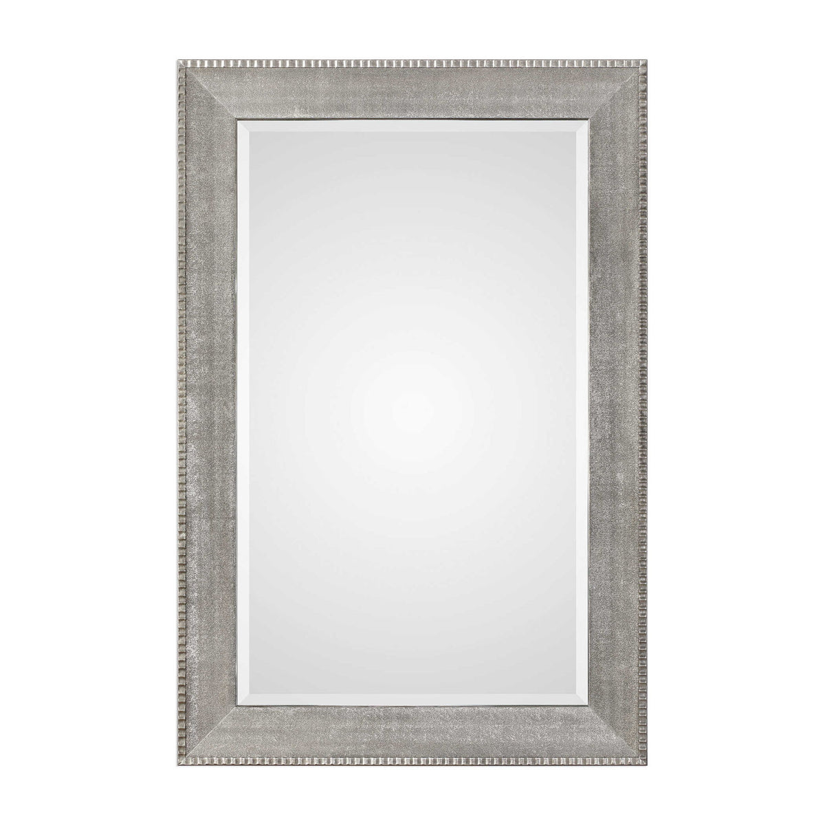 Silver metallic wall mirror with a sleek, modern frame from Uttermost Leiston collection, reflecting light and adding contemporary style.