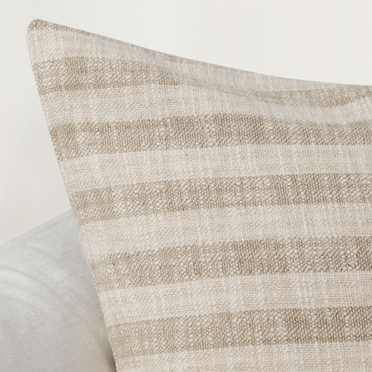 Villa Linna 24-inch accent pillow in ivory and natural tones, square textured design