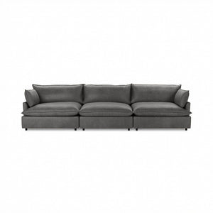 Classic Home Caplan modular sectional in neutral fabric, showcasing its spacious, stylish stationary design with plush cushions.