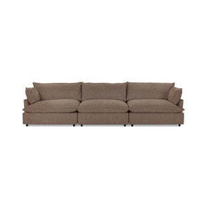 Classic Home Caplan modular sectional sofa with beige fabric upholstery and plush cushions, designed for comfortable seating.