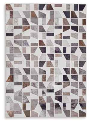 Signature Design by Ashley Jettner area rug with a geometric pattern, featuring neutral tones and soft texture for living room decor.