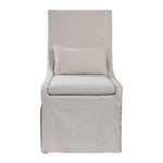 Uttermost Coley armless side chair with plush fabric upholstery and modern design, shown in a stylish living room setting.