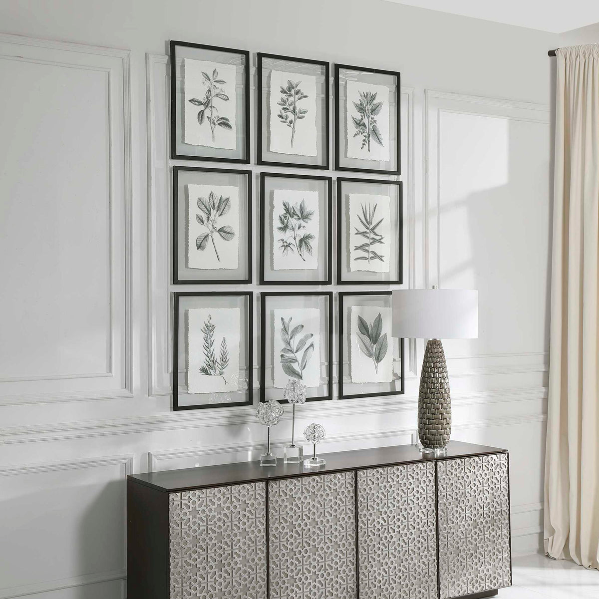 Set of nine farmhouse floral framed prints by Uttermost, black frames with botanical artwork on white backgrounds.