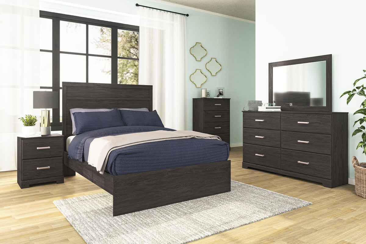 Signature Design by Ashley 5-piece bedroom set includes a bed, nightstands, dresser, and mirror in a modern bedroom setting.