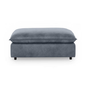Classic Home Caplan upholstered ottoman with cushioned top and wooden legs, versatile accent piece for living rooms.