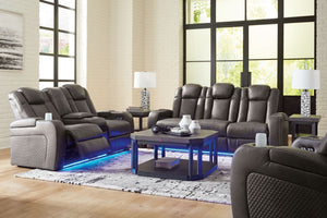 Signature Design by Ashley Fyne-dyme reclining sofa set with plush cushions and reclining features in a modern living room setting.