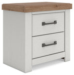 Benchcraft white and brown two-drawer nightstand with built-in charging station, modern design, and sleek finish.
