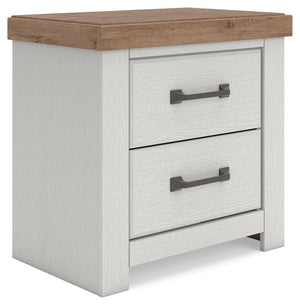 Benchcraft white and brown two-drawer nightstand with built-in charging station, modern design, and sleek finish.