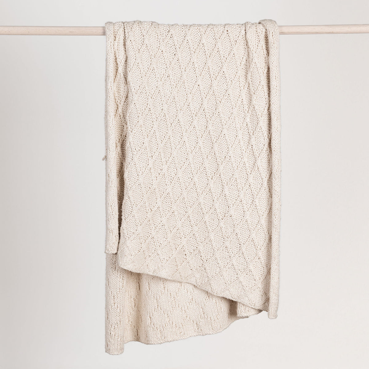 Ivory Catalina throw blanket by Classic Home, soft and cozy fabric perfect for adding warmth and style to your living space.