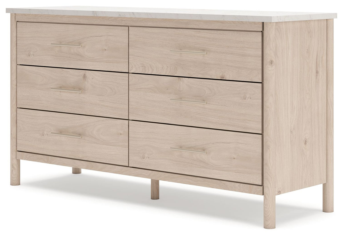Signature Design by Ashley six-drawer dresser with sleek wood finish and modern hardware, offering ample storage space.